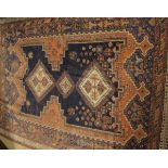 A Caucasian rug, the three central diamond shaped linked medallions in cream,