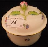 A Herend porcelain pot and cover decorated with exotic birds and flowers