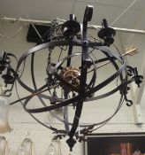 A painted metal ceiling light in the manner of Christopher Wray in the form of an armillary sphere