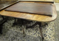 A circa 1900 mahogany dining table in the Regency style,
