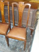 A set of four mahogany and inlaid dining chairs with pinched splat back on straight section