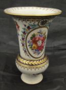 A Sèvres style vase with floral spray decoration within panels of bleu royale, gilt highlighted,