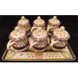 An early 20th Century Dresden six place lidded cup set of baluster form with all-over floral