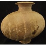 A Chinese Han Dynasty pottery cocoon jar with incised ring decoration,