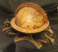 An Italian miniature terrestrial globe in the early manner on a cast brass base