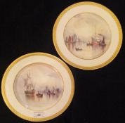 A pair of Cauldon Ltd hand-painted cabinet plates by W E J Dean 1912 depicting shipping in an