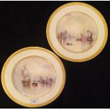 A pair of Cauldon Ltd hand-painted cabinet plates by W E J Dean 1912 depicting shipping in an