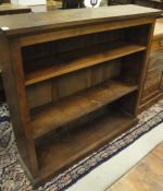 An early 20th Century mahogany open bookcase of three shelves on a plinth base CONDITION