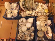 A box containing assorted collector's plates,