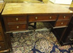 A 19th Century mahogany side table, the plain top above two banks of two drawers,