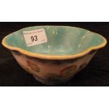 A Chinese polychrome decorated bowl of lobed form, the exterior decorated with roundels,
