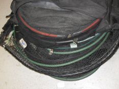 A Daiwa net bag containing five keep nets and six landing nets