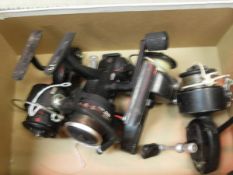 Three Mitchell 300 fixed spool reels and an ABU Garcia "Cardinal 853" fixed spool reel