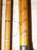 A Hardy "Wanless" two piece split cane spinning rod and an Allcocks three piece split cane fly rod