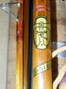 A collection of six assorted fishing rods to include a Sealey three piece coarse rod,