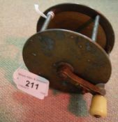 A brass 3½" diameter folding handled, raised crank,