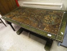 A modern coffee table with 18th Century Spanish leather inset top raised on wrought iron and