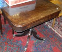 A 19th Century mahogany folding tea table on single turned column to four cabriole legs,