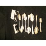 A collection of five various silver table spoons together with a silver desert spoon and teaspoon
