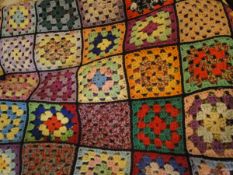 A crocheted patchwork throw