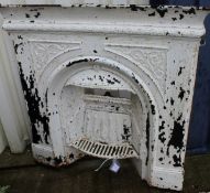 A white painted cast iron fire