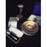 A collection of assorted plated wares to include tea spoons, stem vase, fish knives and forks,