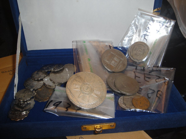 A box containing various Iraqi coinage (pre,