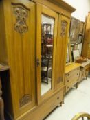 A circa 1900 walnut bedroom suite comprising single door wardrobe with single drawer to base,