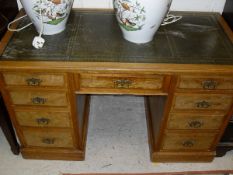 A late Victorian ash pedestal desk,