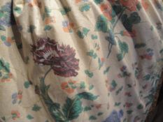 A pair of glazed cotton interlined curtains, the cream ground with floral sprays of purple poppies,