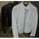A Dolce & Gabbana white leather biker style jacket together with another similar in black