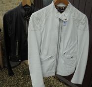 A Dolce & Gabbana white leather biker style jacket together with another similar in black