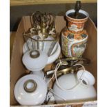 A pair of Victorian milk glass oil lamp bases, two brass hanging lamps with milk glass shades,