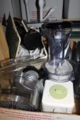 A box containing Braun Multipractic Mixer, Kenwood Juicer, bathroom scales, toilet brushes,