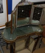A continental carved giltwood framed boudoir type dressing table with mirrored super structure over