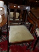 A set of eight early 19th Century mahogany bar back dining chairs with drop-in seats on turned and