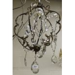 A 20th Century French Rococo style electrolier with brass framework and glass drops