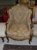 A circa 1900 French carved giltwood and gesso framed salon chair with floral upholstered back seat