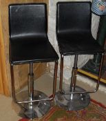 Two chrome framed adjustable bar stools,
