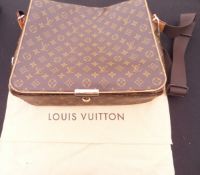 A Louis Vuitton over the shoulder satchel with protective cotton bag