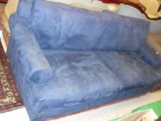 A modern blue upholstered three seat sofa,