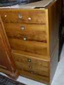 A pair of Heal Furniture Archie Shine yew wood bedside chests of three drawers with brass flush