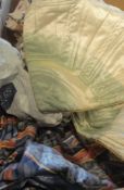 A box containing assorted vinage material and curtains, bed throws etc,