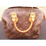 A Louis Vuitton handbag CONDITION REPORTS The Louis Vuitton handbag has general wear