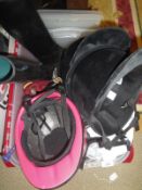 Two boxes of assorted riding equipment to include boots, whips,