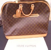 A Louis Vuitton holdall,