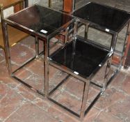 Two side tables in chrome and glass by Eichholtz Smythson