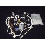 A collection of jewellery to include a jade ring, various pearl necklaces,