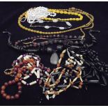 A collection of bead necklaces including five simulated amber etc