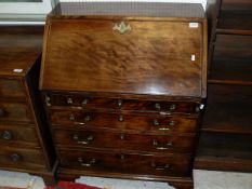 An early 19th Century mahogany bureau of small proportions,